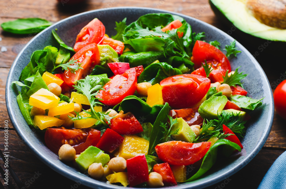 Vegetable Salad, Healthy Eating, Vegetarian Salad with Chickpeas, Avocado, Pepper, Spinach, Cherry Tomatoes in a Bowl