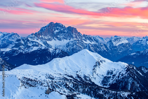 Red clouds over sharp winter mountain peaks in the dolomites © Leek