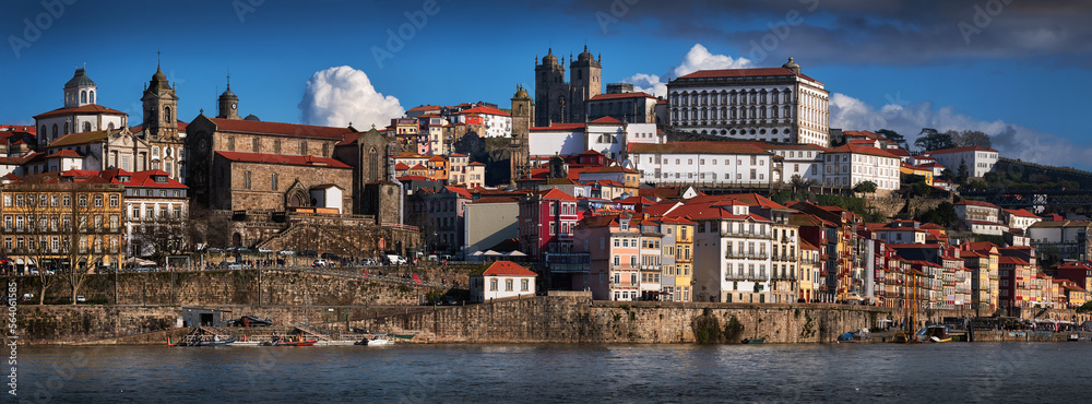 Porto, Portugal. Panoramic cityscape image, wiev from the river Douro. Historic town with colorful buildings.