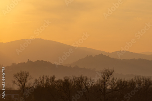 Foschia prima del tramonto sulle colline marchigiane photo
