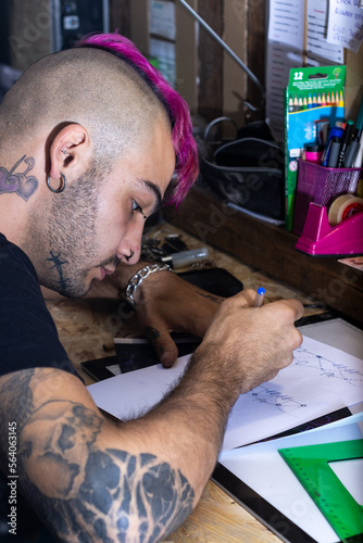 Close-up of a tattoo artist drawing. Professional tattoo artist drawing a design for the client, Concept of tattoo artist drawing art for the client