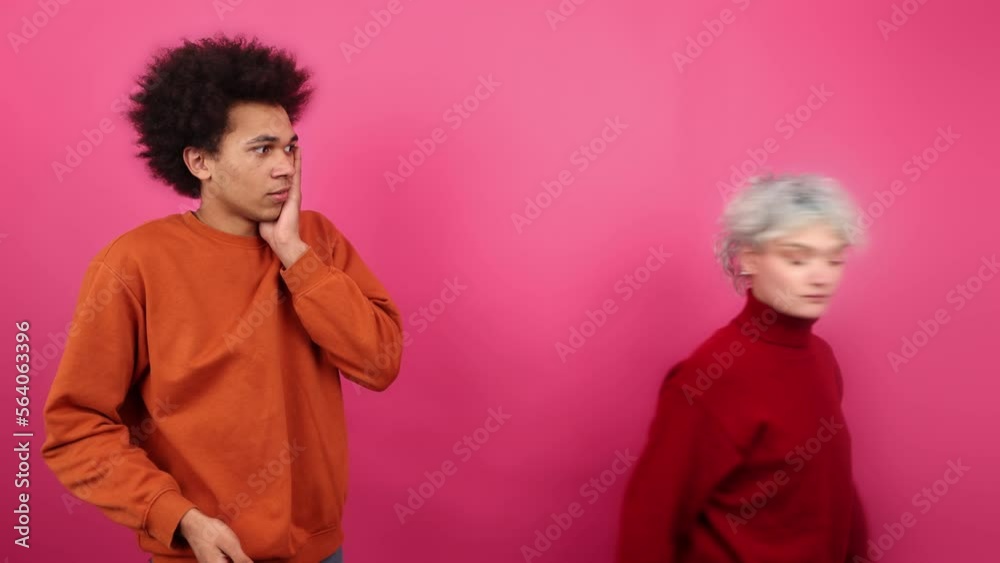 Portrait of blonde-haired woman slapping a man. Close-up view of angry girlfriend breaking up with her boyfriend. High quality 4k footage Portrait of blonde-haired woman slapping a man. Close-up view of angry girlfriend breaking up with her boyfriend. High quality 4k footage