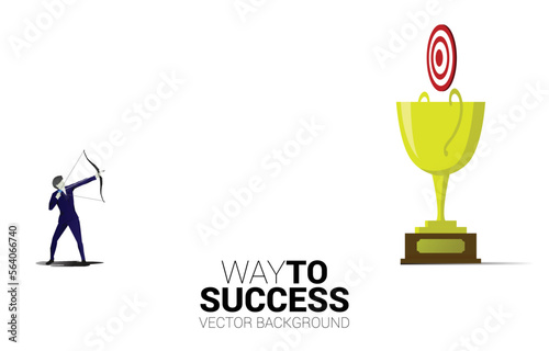 Businessman in suit shoot the arrow to target on champion trophy. Business Concept of leadership goal and vision mission