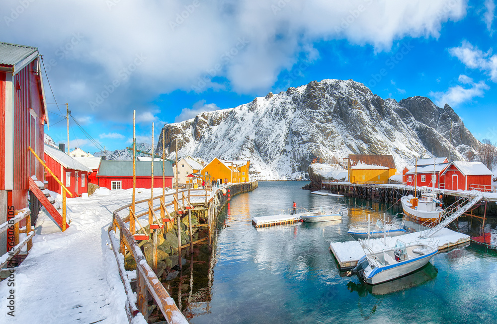 Awesome morning seascape of Norwegian sea and cityscape of Nusfjord village.