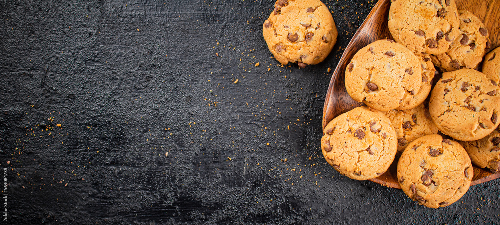 Delicious cookies with pieces of milk chocolate on a plate. Delicious cookies with pieces of milk chocolate on a plate.
