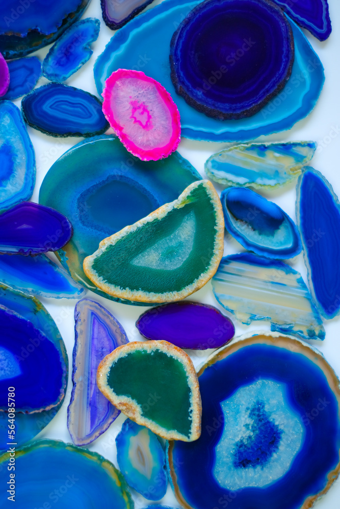 slices of natural stone . Agates set in blue and green colors.Texture ...