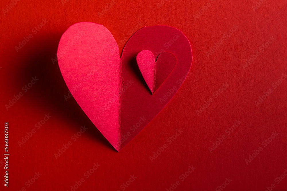 hand cut hearts over red hand cut hearts over red