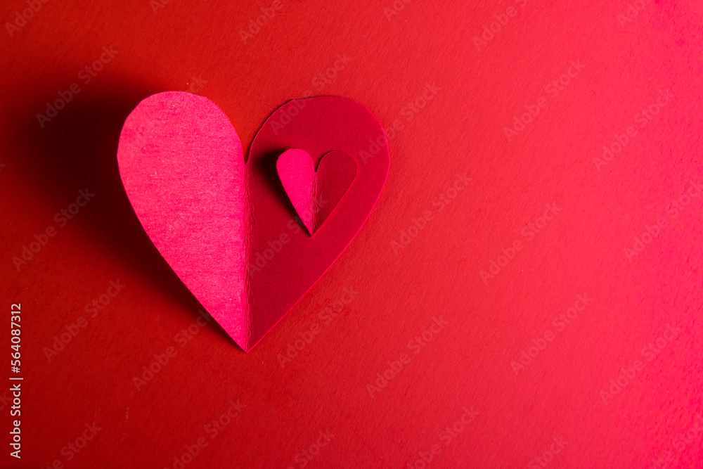 Obraz premium hand cut hearts over red