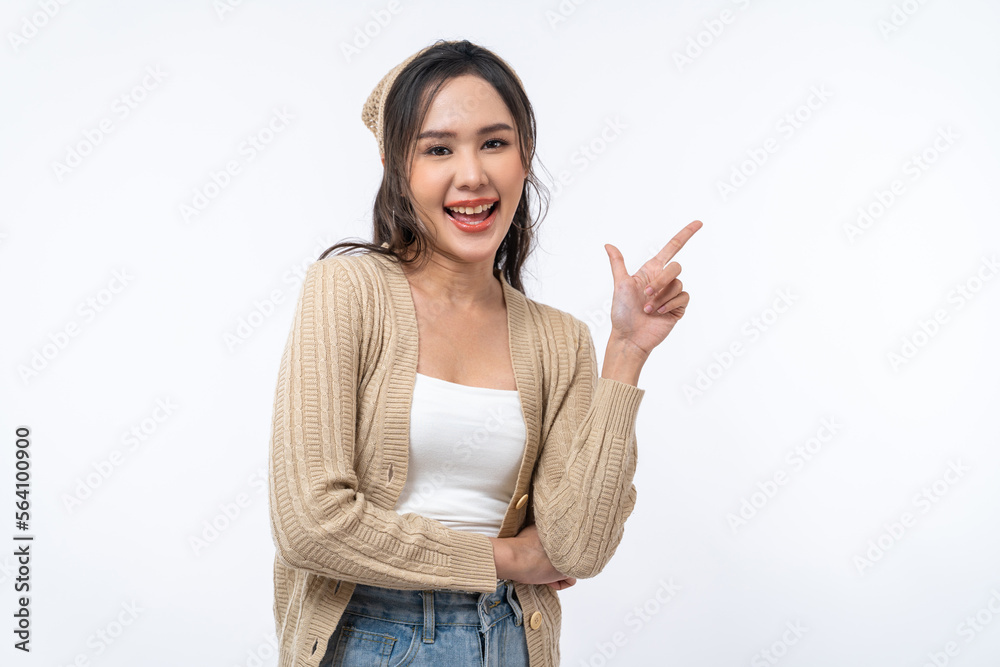 Happy Asian woman is smiling and pointing finger to copy space isolated on white background. Happy Asian woman is smiling and pointing finger to copy space isolated on white background.