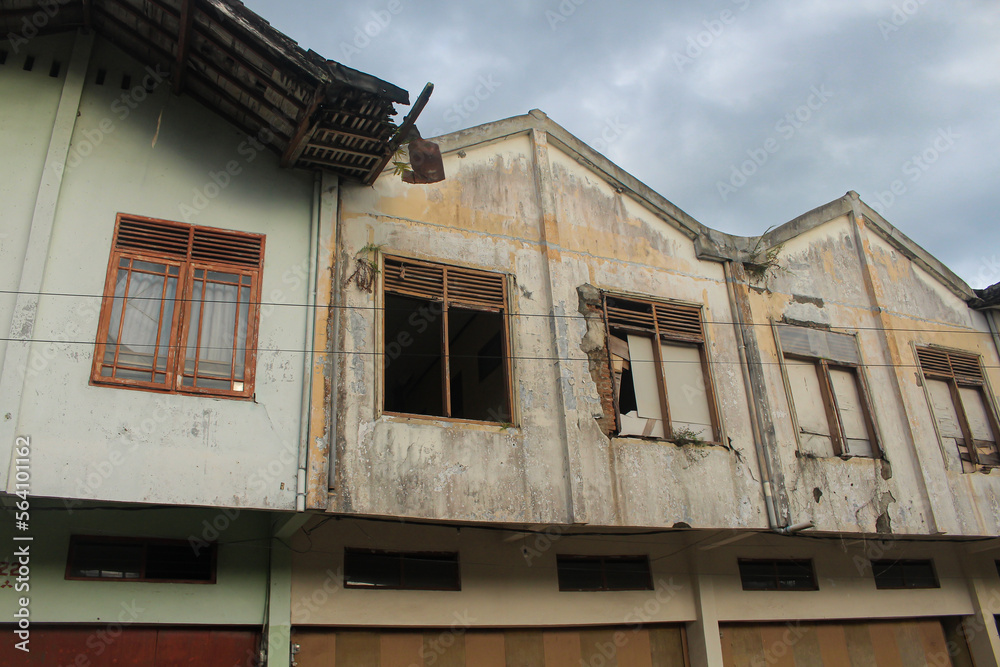 damaged and abandoned old shophouse building
