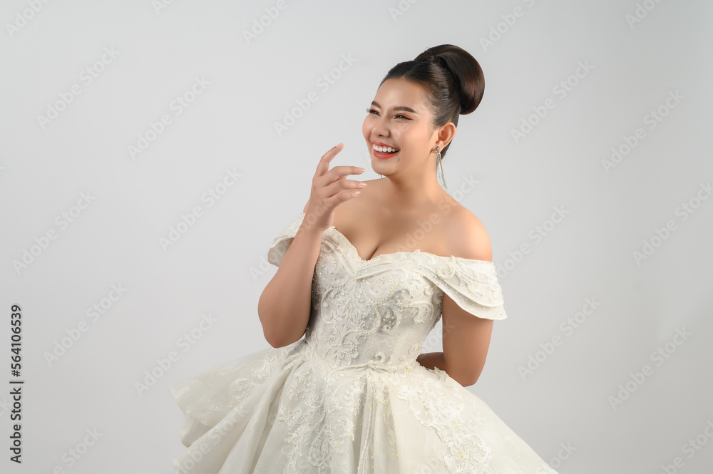 Young asian beautiful bride smiling with happy on white background Young asian beautiful bride smiling with happy on white background