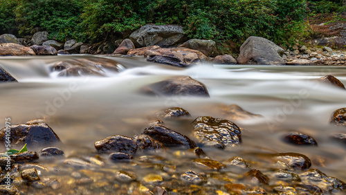 water flowing over rocks photo