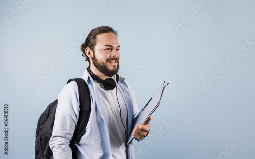 young hispanic man student university on blue background in Mexico Latin America