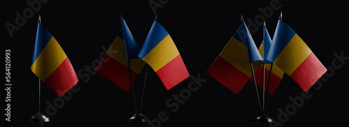 Small national flags of the Chad on a black background