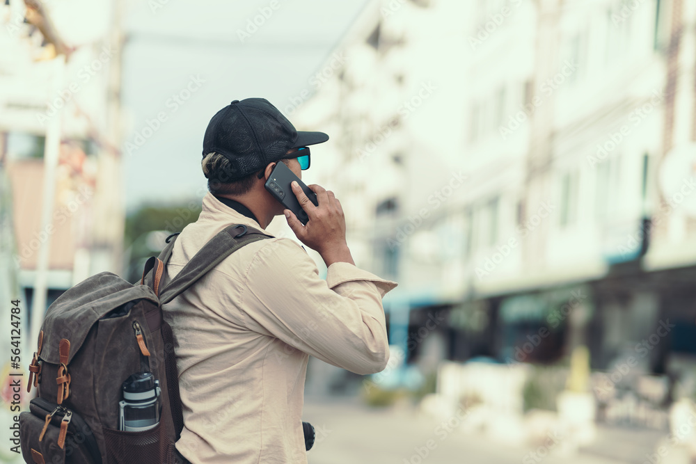 Tourists call to reserve a hotel or ask for directions from the side of the road. travel concept.. Tourists call to reserve a hotel or ask for directions from the side of the road. travel concept..