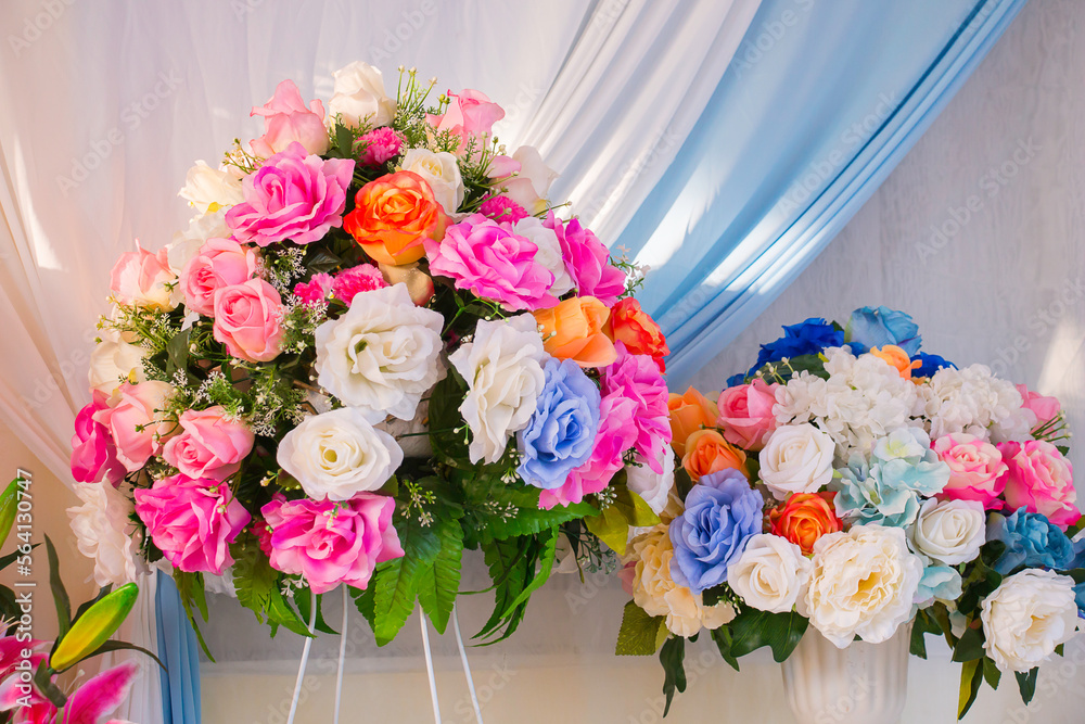 Many kinds of beautiful fake flowers for setting up the backdrop in various ceremonies