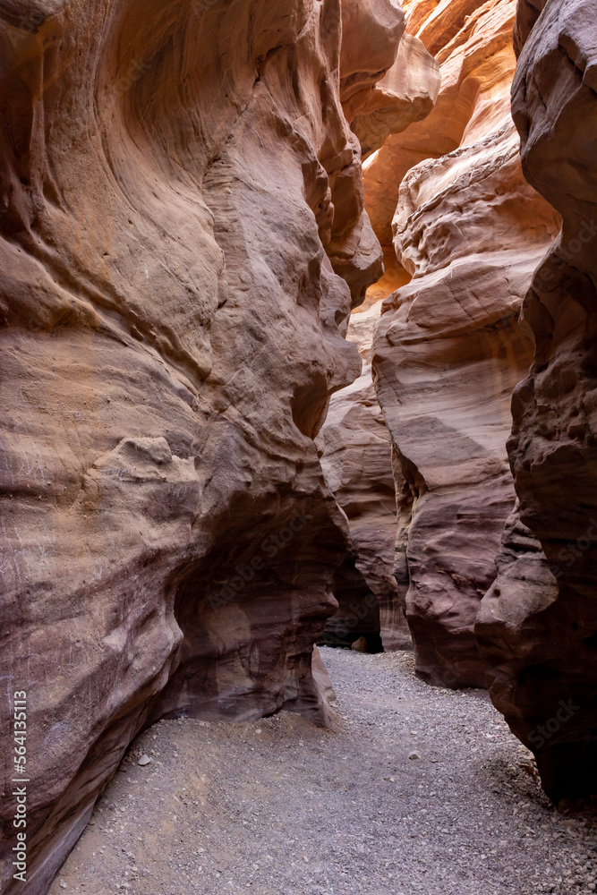 Fantastically beautiful landscape in the national nature reserve - Red Canyon in the rays of the setting sun, near the city of Eilat, in southern Israel