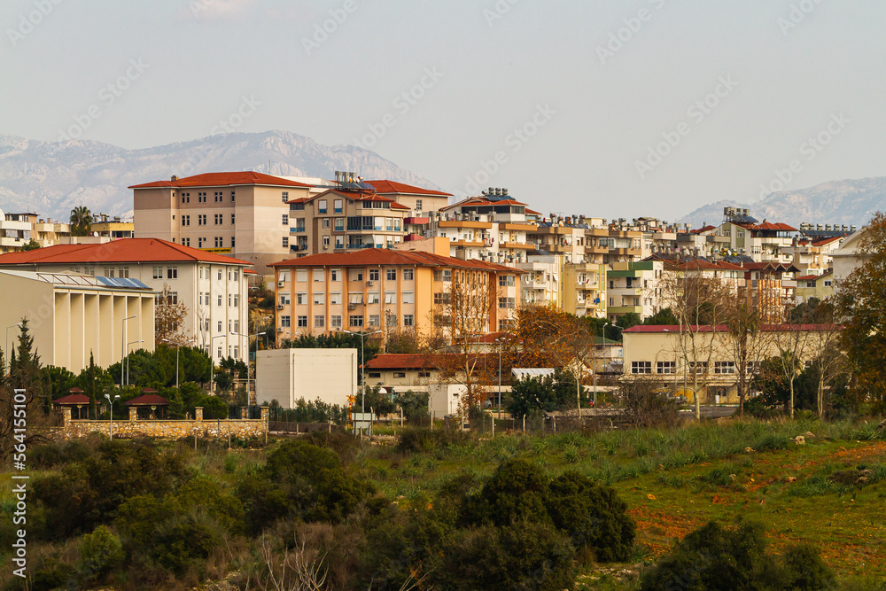 Side, Turkey -January 21, 2023:  Colorful Turkish streets with low houses,   palms
