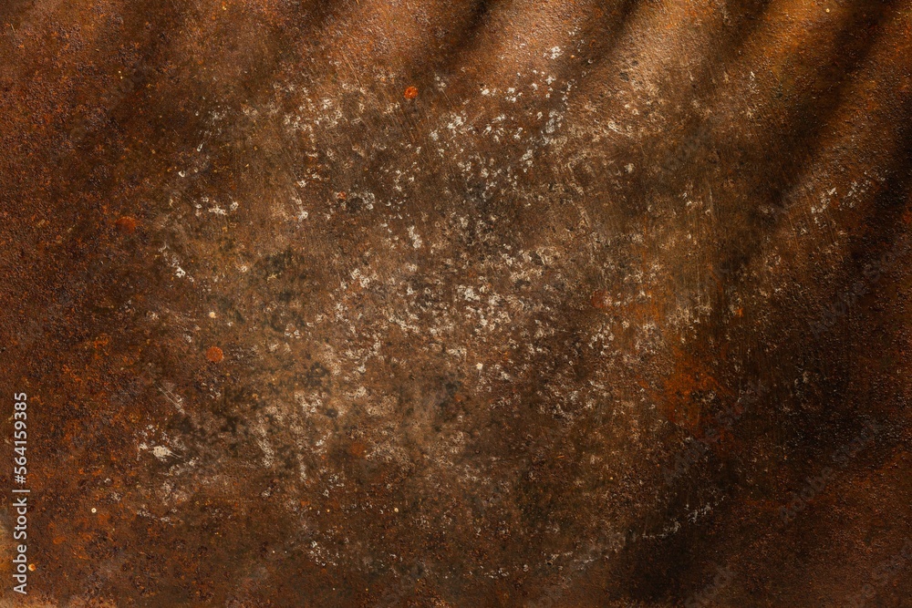 Fototapeta premium Rusty metal plate- corrosion on a dark red background. Abstract rust texture