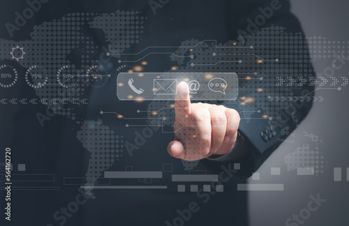 Company communication concept. Contact us. Businessman touching virtual screen to search contact information, email, phone, address, live chat message. global connection.