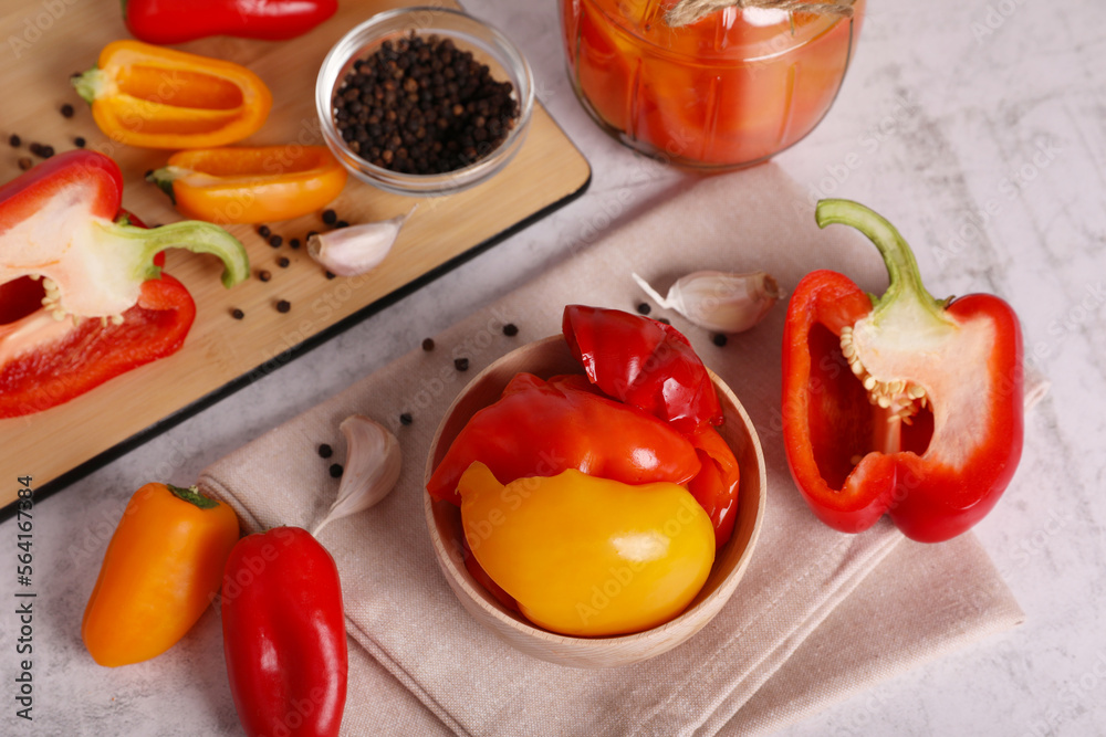Tasty pickled peppers and fresh vegetables on table, above view