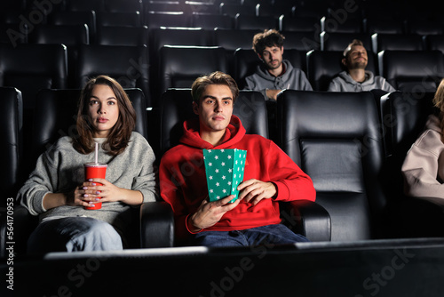 People who are passionate about the film look at the screen in the cinema