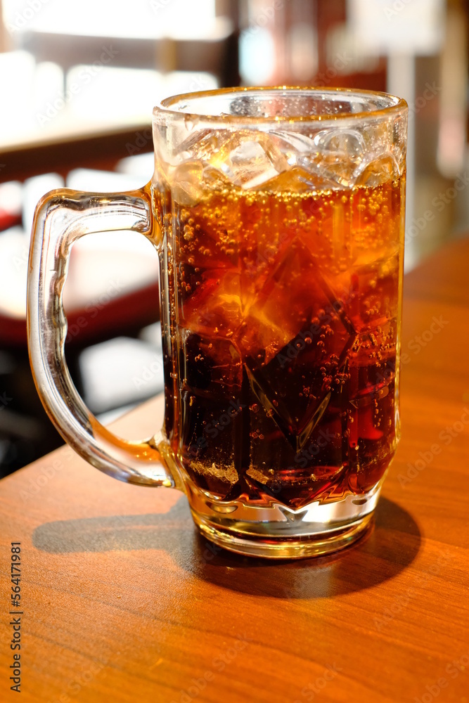 a big glass of cola on the table a big glass of cola on the table