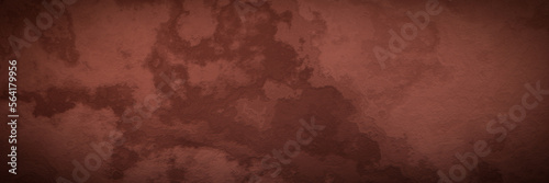 Red soil wall background. Weathered rock surface texture.
