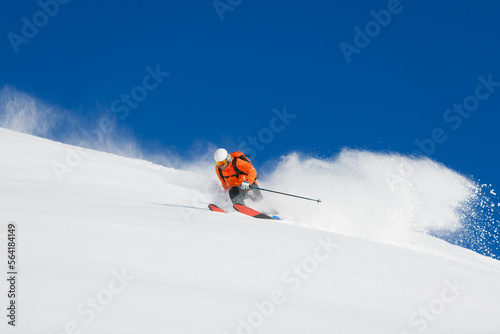 Free-rider skier alone in powder snow