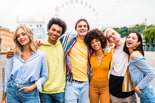 Multiracial young people together meeting and social gathering - Group of friends with mixed races having fun outdoors in the city- Friendship and lifestyle concepts © oneinchpunch