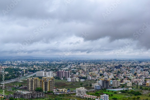 A clear top view of City in India from top of the mountains during rainy season.