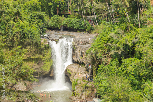 Tegenungan waterfall  Bali  Indonesia. Jungle  forest  daytime with cloudy sky.