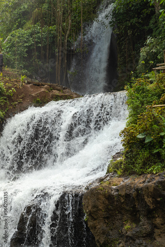 Uma Anyar waterfall  Bali  Indonesia. Jungle  forest  daytime with cloudy sky.