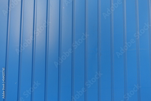 Smooth surface of electric blue wall with plastic siding