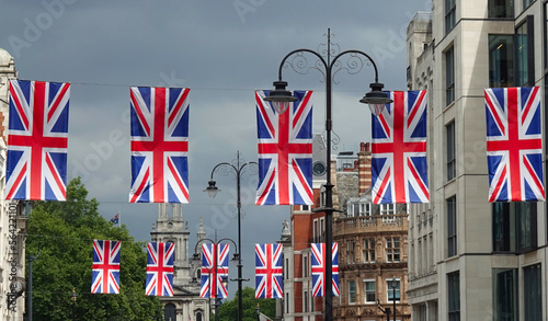Photography Union Jack flags hanging over the Strand in central London, UK.
