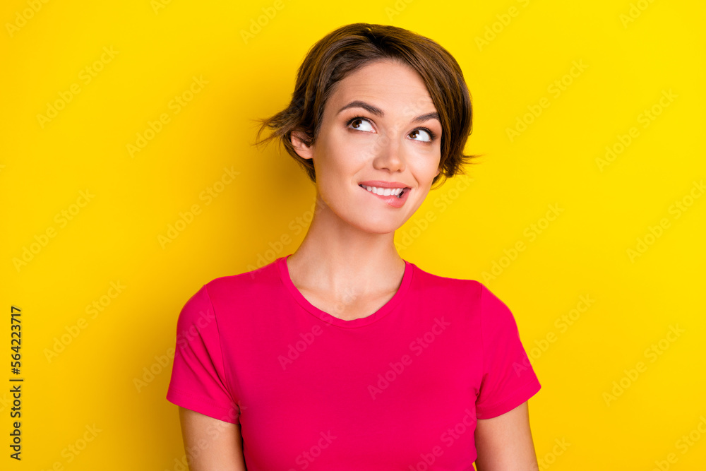 Photo of lovely cute lady wear pink stylish clothes look up special offer empty space banner isolated on yellow color background Photo of lovely cute lady wear pink stylish clothes look up special offer empty space banner isolated on yellow color background