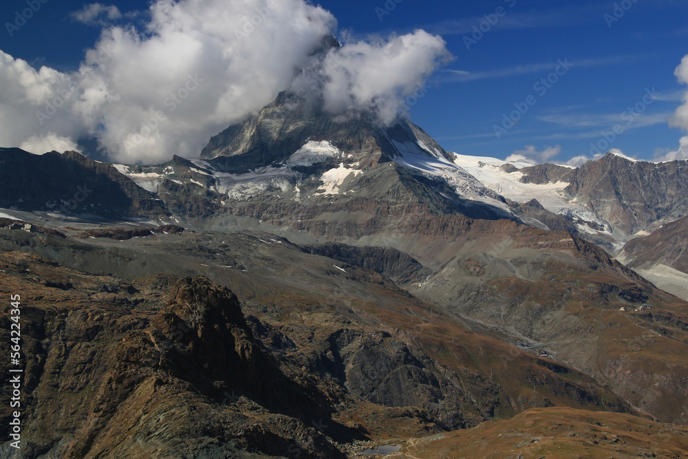 Landscape with a mountain Matterhorn view partially covered by clouds on a mountain Gornergrat, near Zermatt, in southern Switzerland	