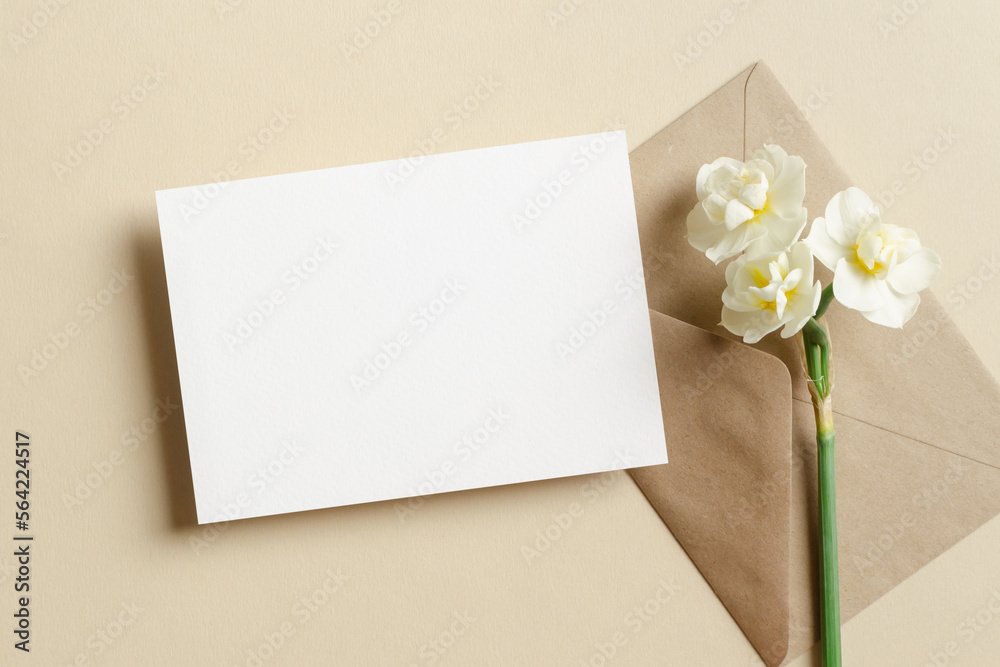 Wedding invitation card mockup with envelope and daffodils flowers Wedding invitation card mockup with envelope and daffodils flowers