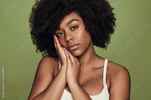 Charming black woman in underwear looking at camera and looking at camera