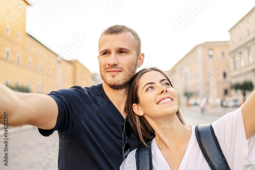 Happy Young couple taking selfie portrait with smartphone mobile outdoor. Tourism, friendship, youth and weekend activities concept © Olga