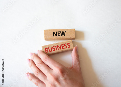 New business symbol. Concept words New business on wooden blocks. Beautiful white background. Business and New business concept. Copy space.