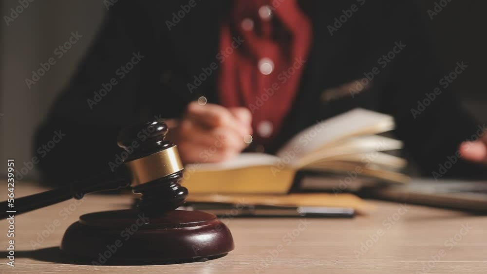 Business and lawyers discussing contract papers with brass scale on desk in office. Law, legal services, advice, justice and law concept picture with film grain effect Business and lawyers discussing contract papers with brass scale on desk in office. Law, legal services, advice, justice and law concept picture with film grain effect