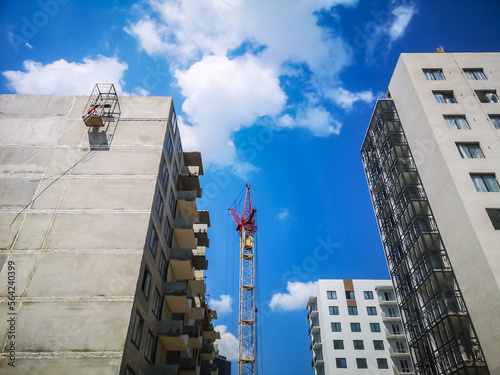 tower crane at the construction site. Construction of apartments in a new residential complex