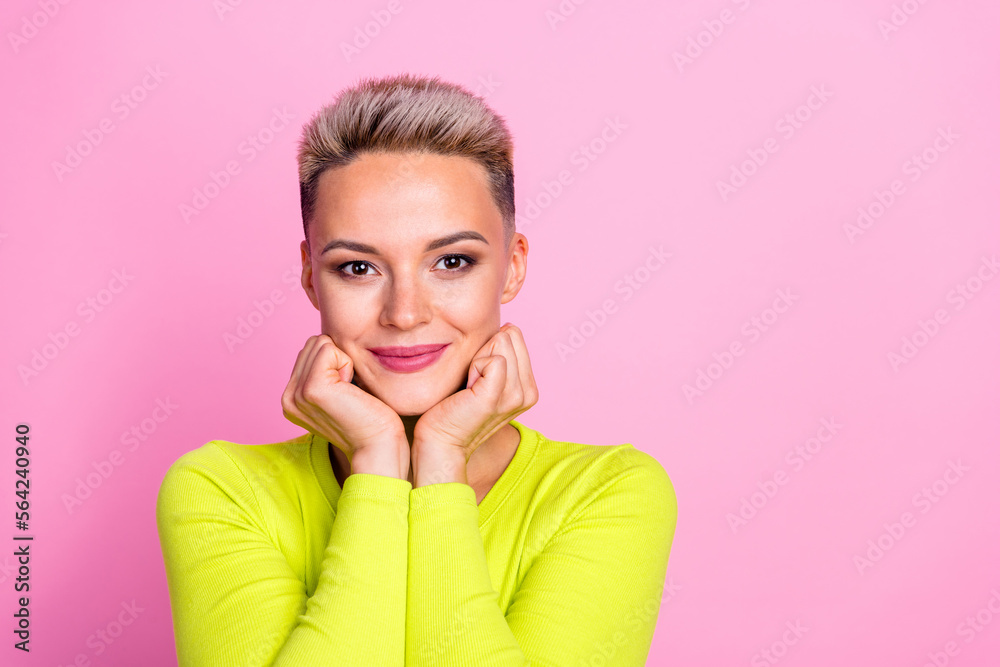 Portrait of cute stunning lady arms touch cheeks empty space isolated on pink color background Portrait of cute stunning lady arms touch cheeks empty space isolated on pink color background
