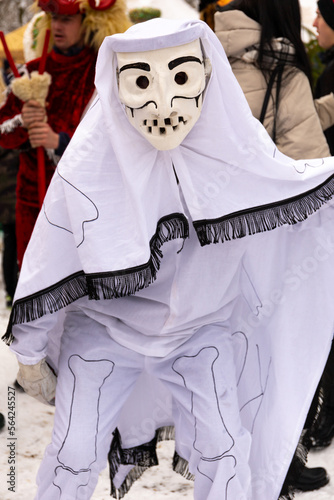 Gody Zywieckie - traditional winter parade of 'Dziady', folk custom in Zywiec region, man dressed in traditional costume of death, Milowka, Poland