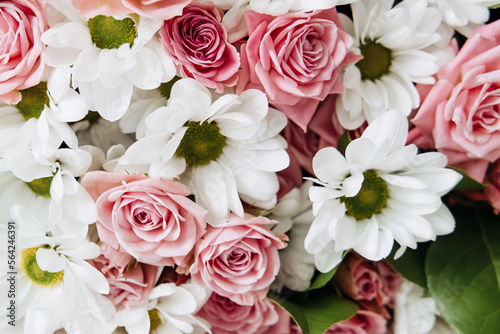 Background of beautiful bouquet of rose and chrysanthemums flowers. Backdrop for holiday, birthday, Wedding, Mother's Day, Valentine's day, Women's Day. Floral arrangement. © Lyubov