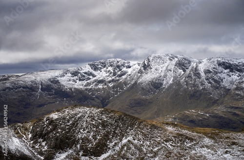 The snow covered mountain summit of Crinkle Crags from Langdale Pikes in the Cumbrian Lake District Mountains  England UK.