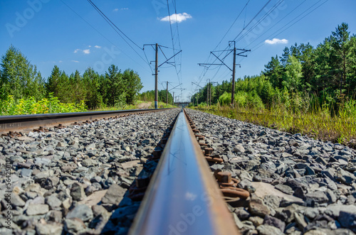 Empty railway path. Rails extending into the distance.