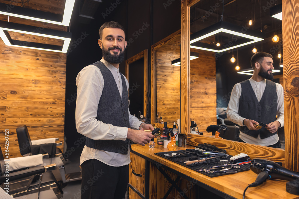 Barber with hairdressing tools an the barbershop Barber with hairdressing tools an the barbershop