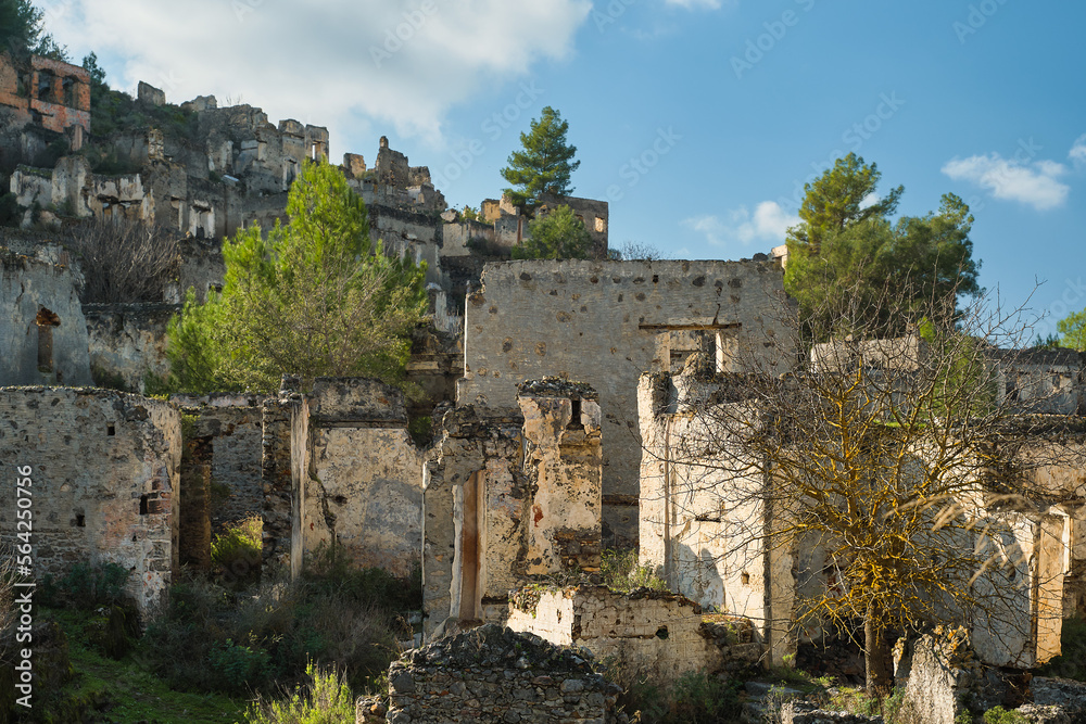 View of the abandoned city next to Kayakoy. Karmilissos abandoned ghost town in Fethiye - Turkey, ruins of stone houses. Site of the ancient Greek city